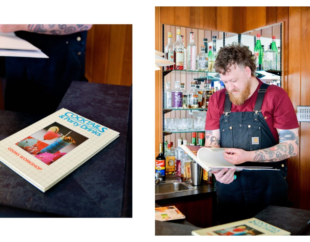 Scott enjoying the retro cocktail recipe books left behind by the previous family